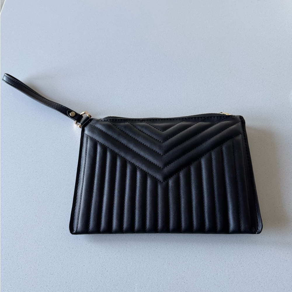 A new Day Brand clutch with wrist strap